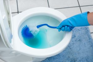 commercial janitorial and cleaning services image of hand scrubbing cleaning toilet business restroom cleaning